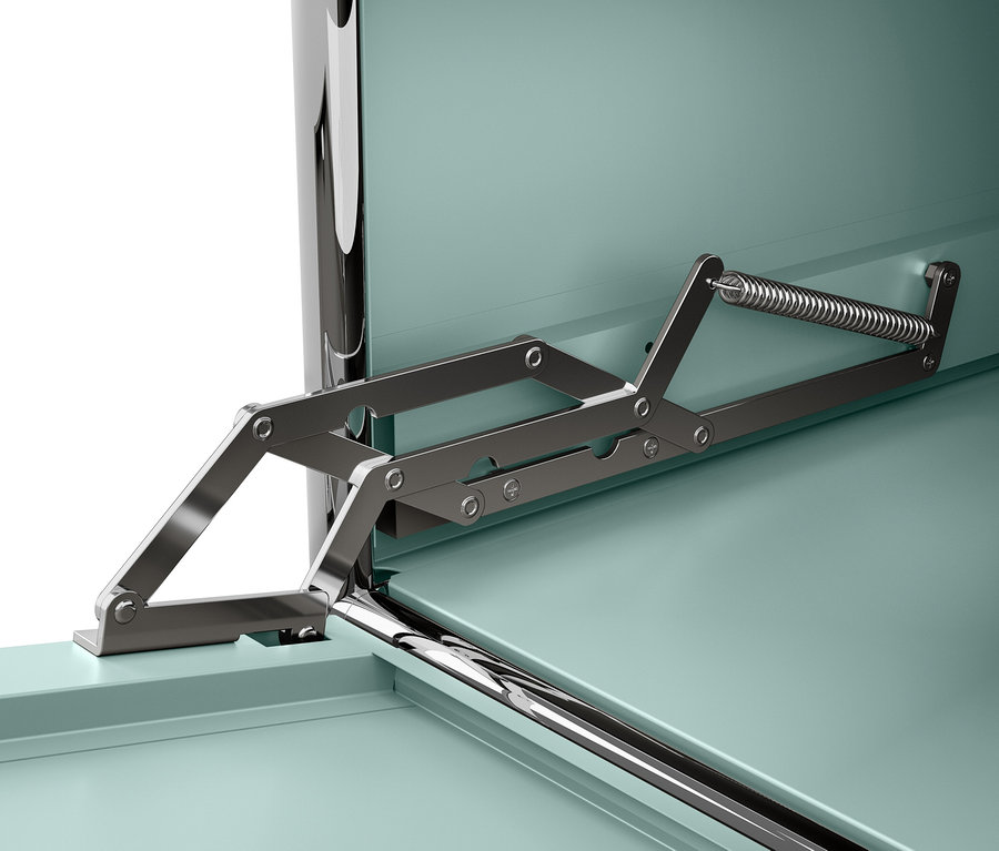 Detail kovového mechanizmu s pružinou pripevneného k tyrkysovej skrinke.