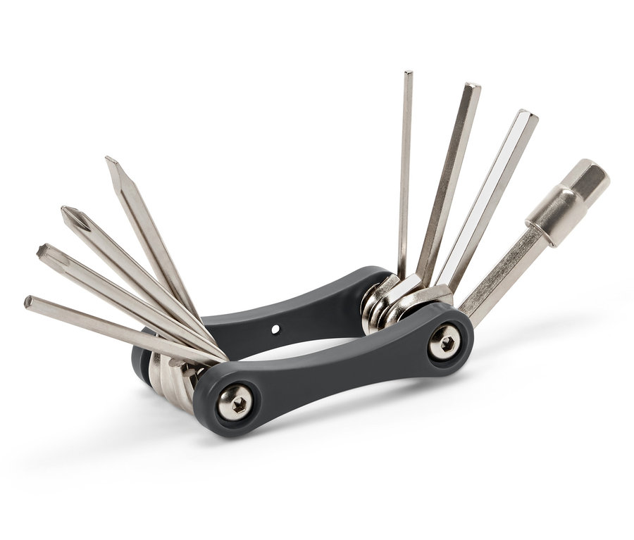 Sivé multifunkčné náradie s rôznymi striebornými nadstavcami.