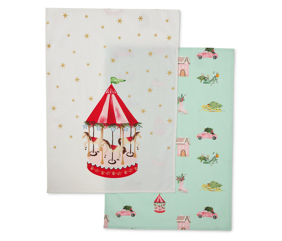 Dve látkové utierky: jedna s kolotočom, druhá so zimnými motívmi.