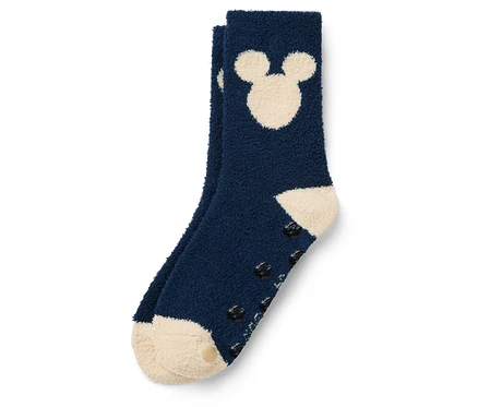 Detail modrej ponožky s Mickey Mousom a protišmykovou podrážkou.