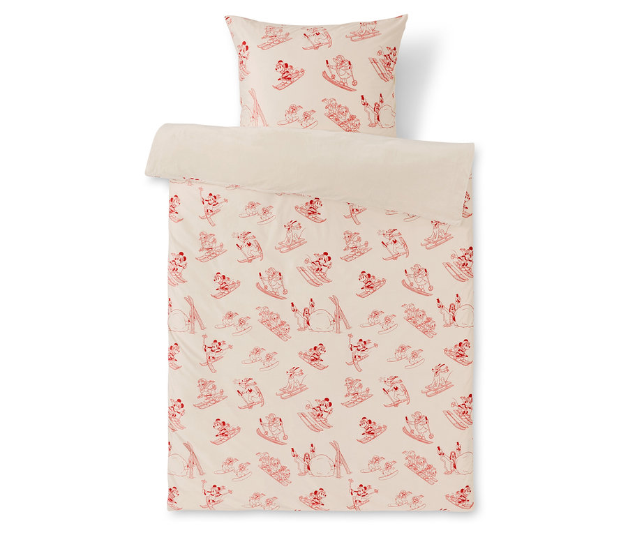Posteľná bielizeň s červeným vzorom lyžujúcich postavičiek na bielom pozadí.