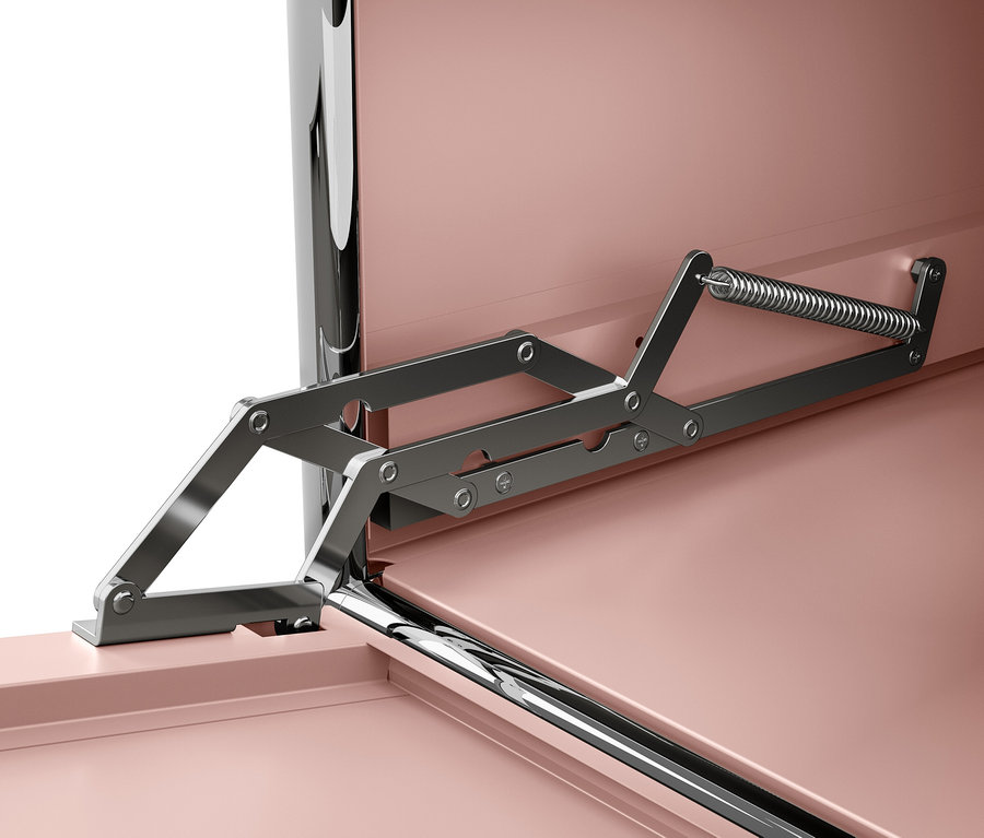 Detail mechanizmu otvárania veka vo vnútri nábytku s ružovými plochami.