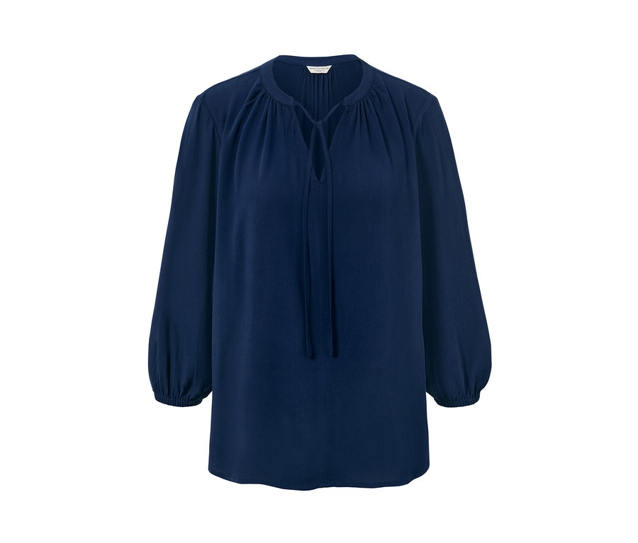 Modrá tuniková blúzka s dlhými rukávmi.