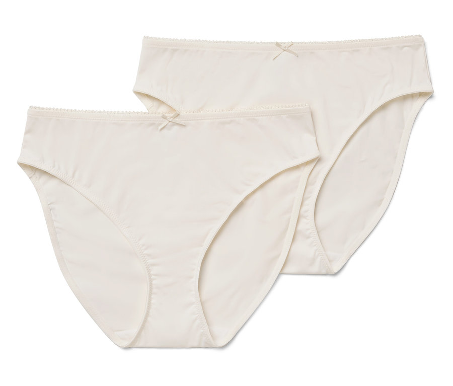 Dvoje dámske nohavičky smotanovej farby s mašličkou.