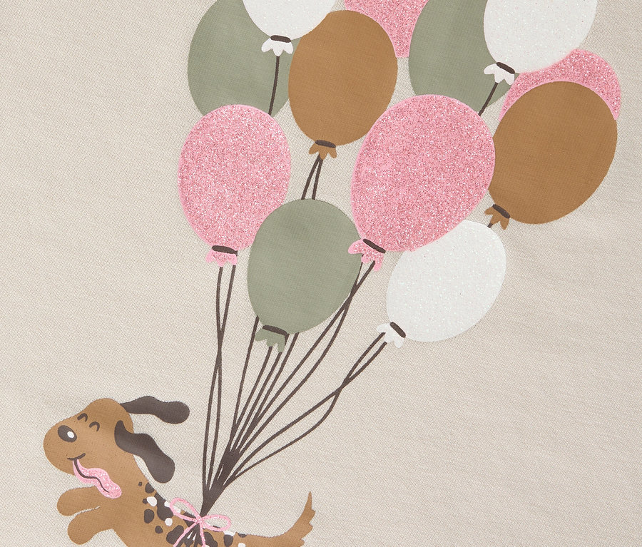 Grafika kresleného psa visiaceho na sérii balónov.