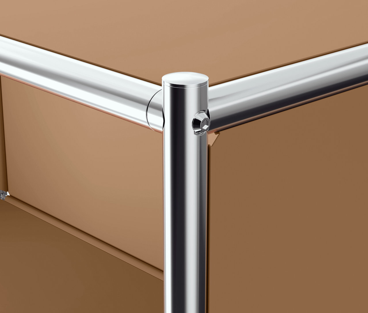 Detail rohu hnedého nábytku s chrómovanou rúrkovou konštrukciou.