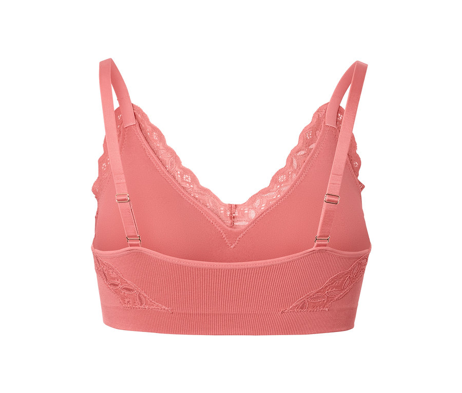 Detailný záber na koralovú bezšvovú podprsenku s čipkovaným lemom.