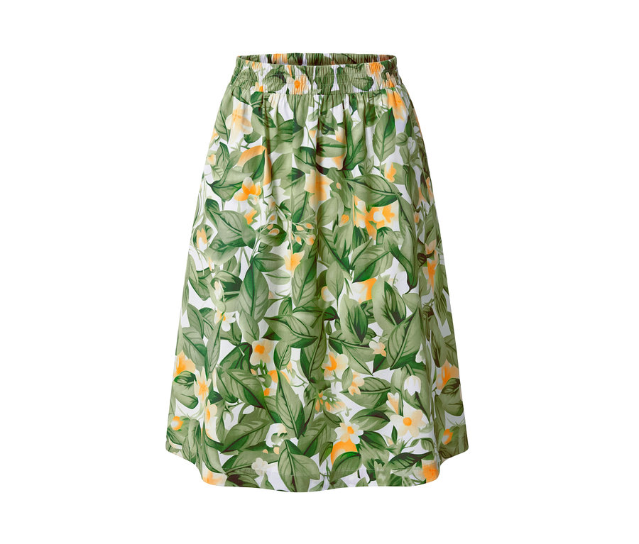 Popelínová sukňa s potlačou so zelenými listami a žltými kvetmi na bielom pozadí.