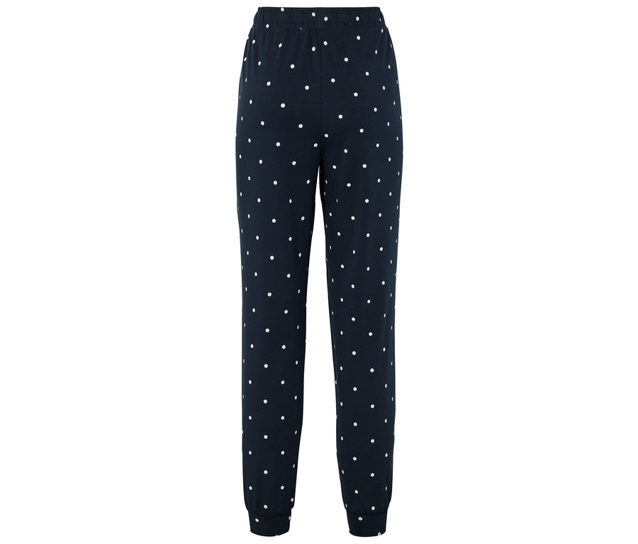 Tmavomodré tepláky s bielymi bodkami.