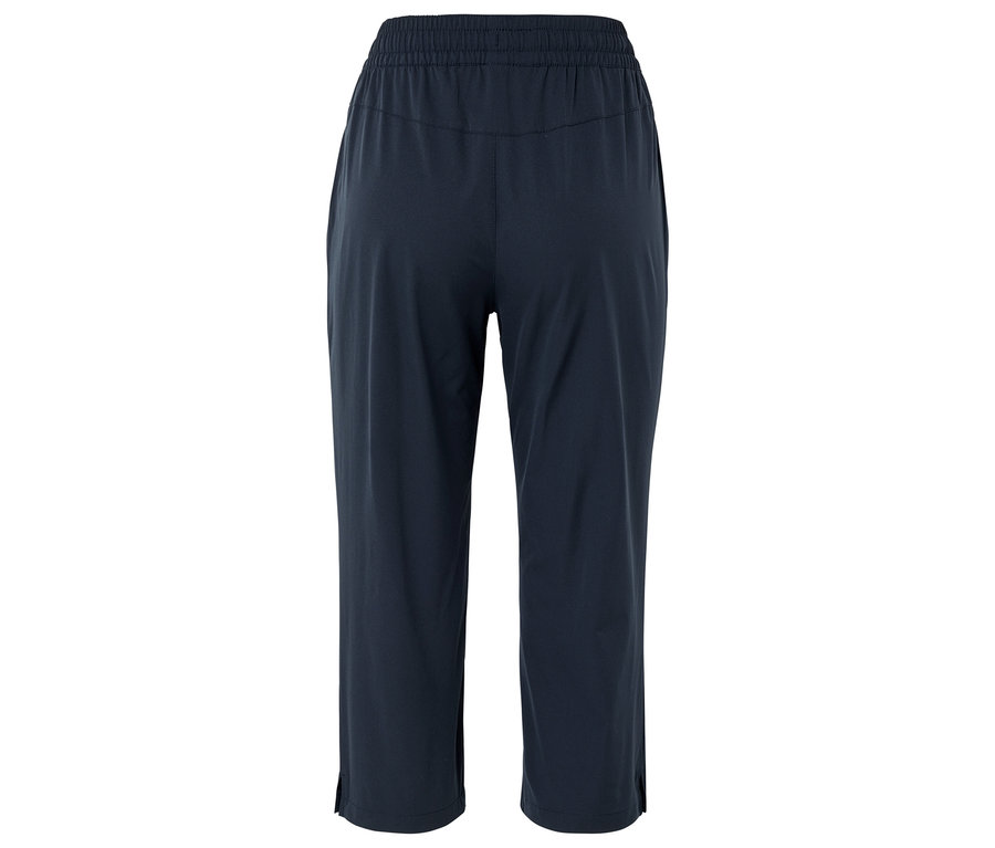 Tmavomodré, voľné nohavice s gumou a bočnými rozparkami, fotené zozadu.