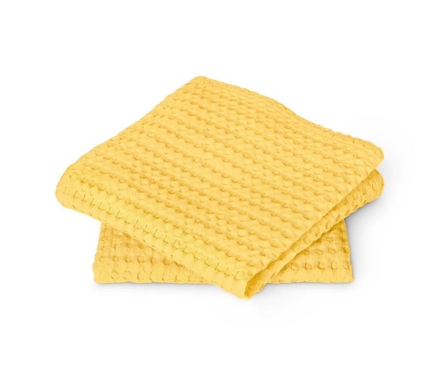 Dva žlté utierky do kuchyne, 2 ks, zložené na sebe.