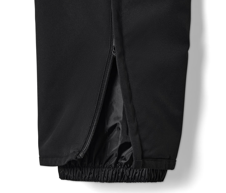 Detail čiernych lyžiarskych nohavíc High-Tech so zipsom na boku nohavice.