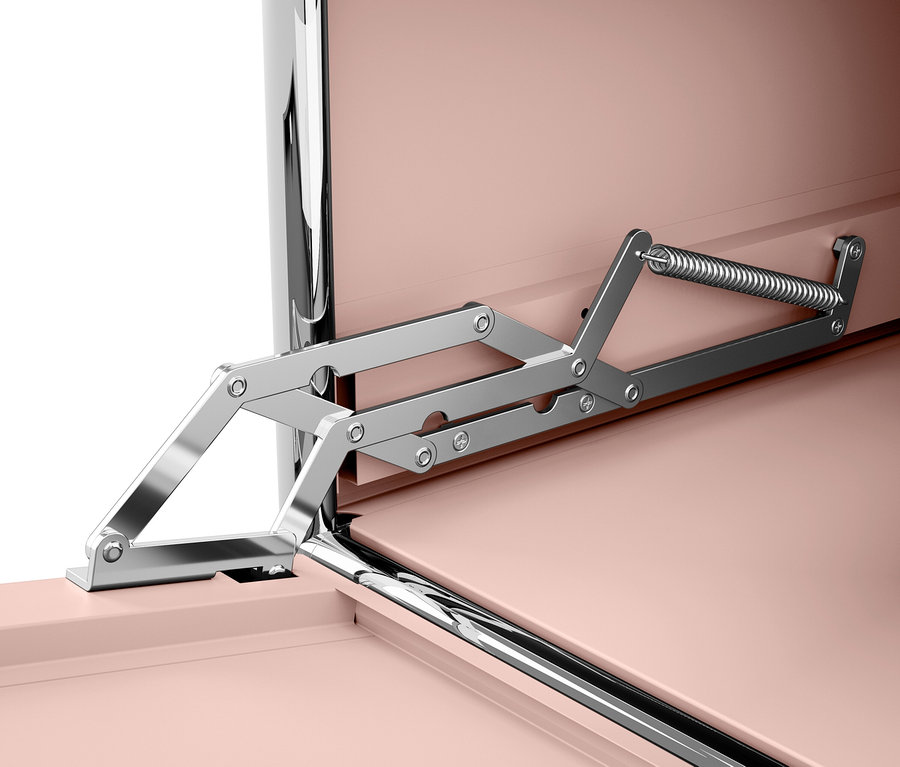 Detail otváracieho mechanizmu ružovej skrinky.