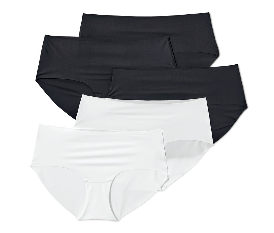 Na obrázku je päť kusov nohavičiek »Magic Cut«, čiernej a bielej farby, usporiadané na sebe.