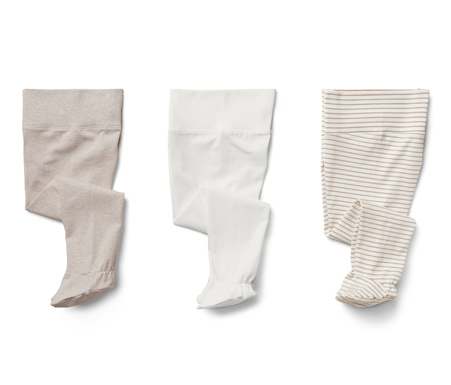 Troje dojčenských dupačiek: béžové, biele a pruhované.