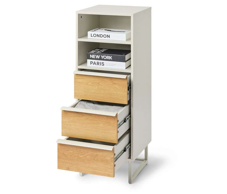 Modul so zásuvkami »LEEG« s 3 zásuvkami, pričom jedna zásuvka je čiastočne otvorená a na vrchu sú knihy.