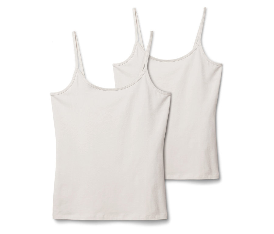 Dve biele tielka s tenkými ramienkami ležia vedľa seba na bielom pozadí.