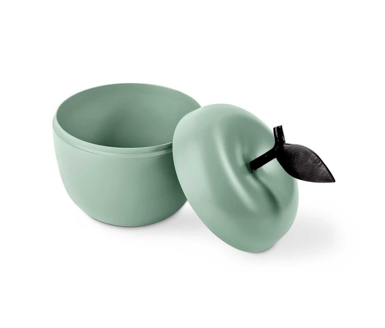 Otvorená dekoračná dóza svetlozelenej farby v tvare jablka s čiernym stonkom a listom.