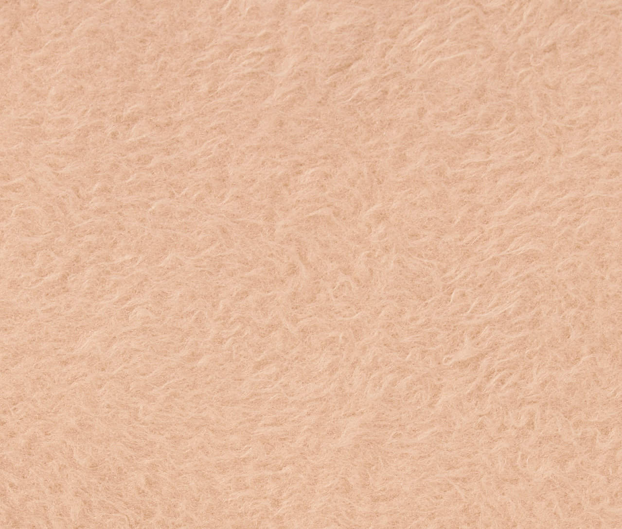 Detailný záber na textúru svetlooranžovej látky.