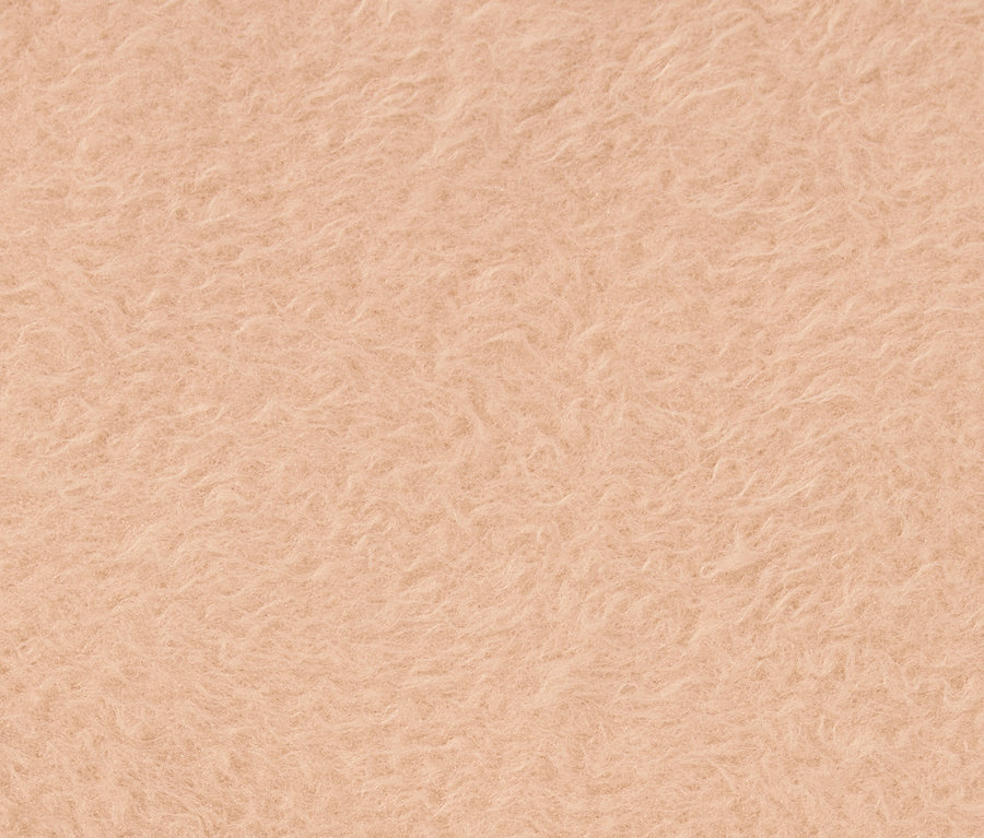 Detailný záber na textúru svetlooranžovej látky.