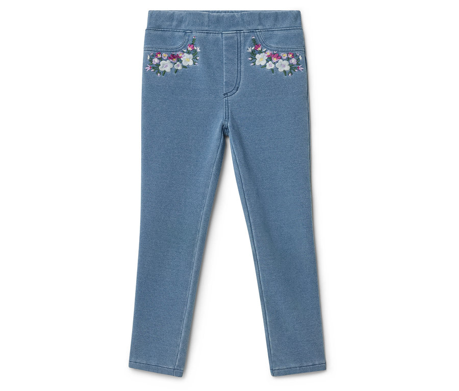 Svetlé džínsové nohavice s kvetinovou výšivkou na vreckách.