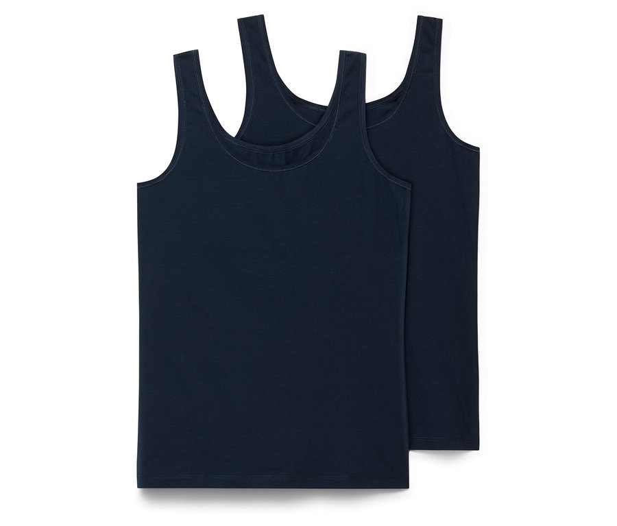 Dve tmavomodré tielka ležia na sebe.