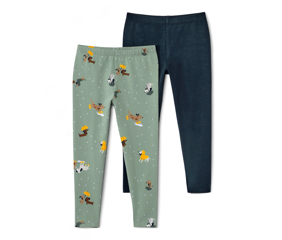 Dvoje detské legínsy: jedny svetlozelené s potlačou psov, druhé tmavomodré.