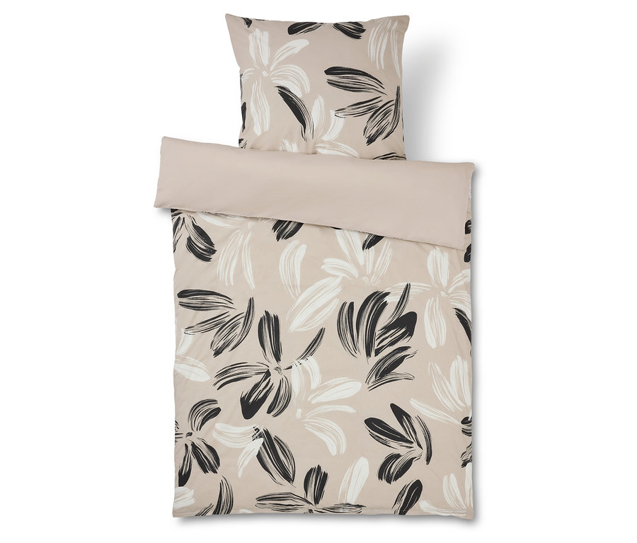 Obliečky s kvetinovým vzorom v béžovej a čiernej farbe a zodpovedajúca obliečka na vankúš.