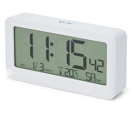 Biely LCD rádiový budík s digitálnym displejom zobrazujúcim čas 11:15, dátum 1/3 a teplotu 20,5°C.
