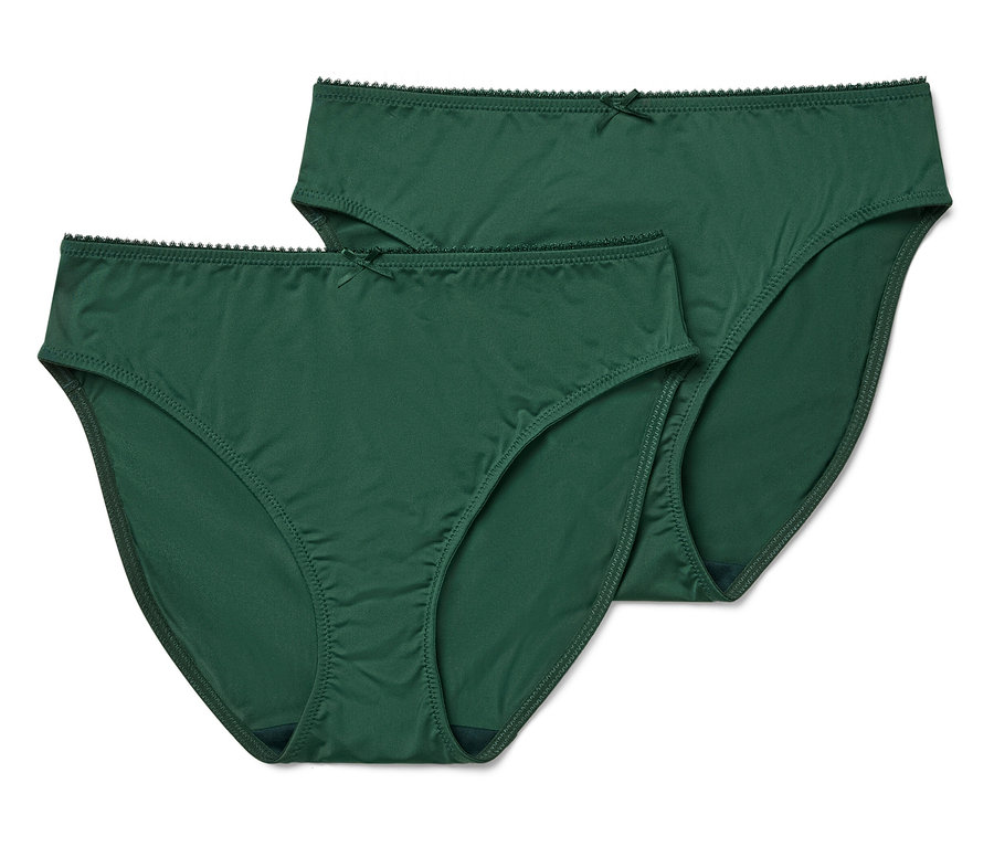 Dvoje zelené nohavičky klasického strihu s mašličkou ležia na bielom pozadí.