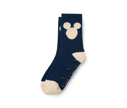 Detail modrej ponožky s Mickey Mousom a protišmykovou podrážkou.