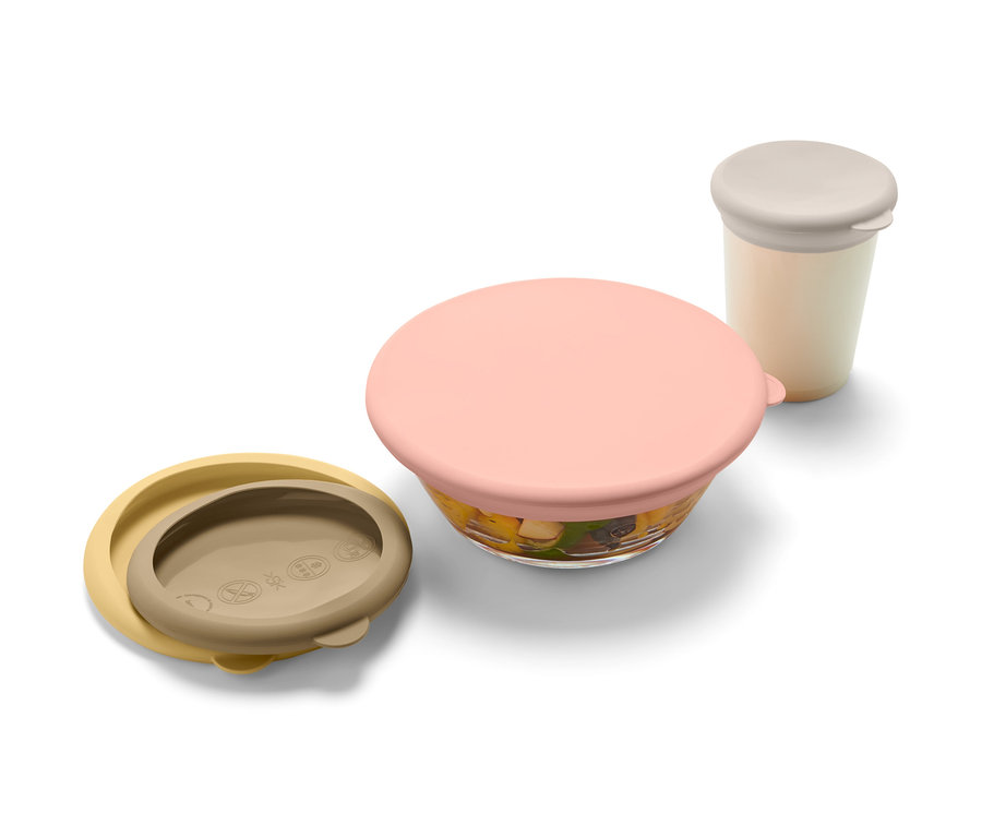 Sada silikónových veka na uchovávanie potravín v čerstvom stave, 4 ks, vo farbách žltá, ružová a krémová. Jedno veko je otvorené.