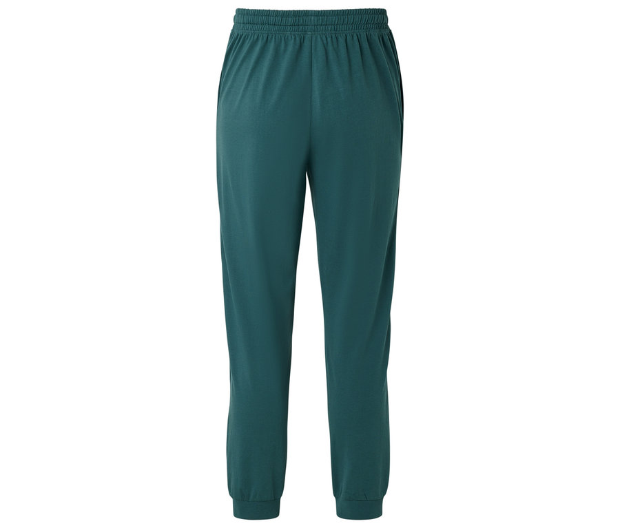 Zelené tepláky s elastickým pásom a manžetami na členkoch.