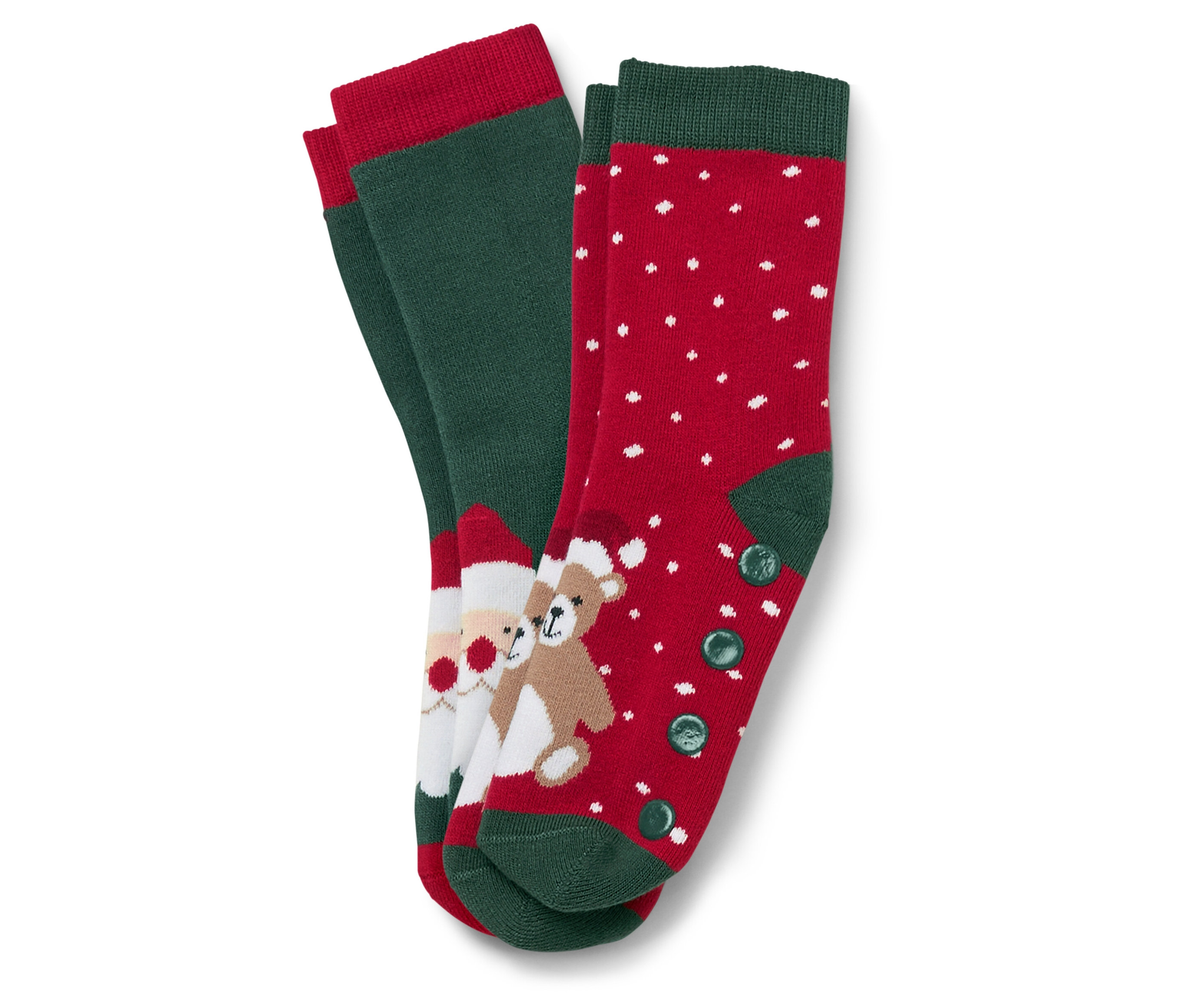 Dva páry vianočných ponožiek. Jeden pár je zelený s červeným lemom a obrázkom Santa Clausa a medvedíka. Druhý pár je červený s bielymi bodkami a zeleným lemom a gombíkmi.