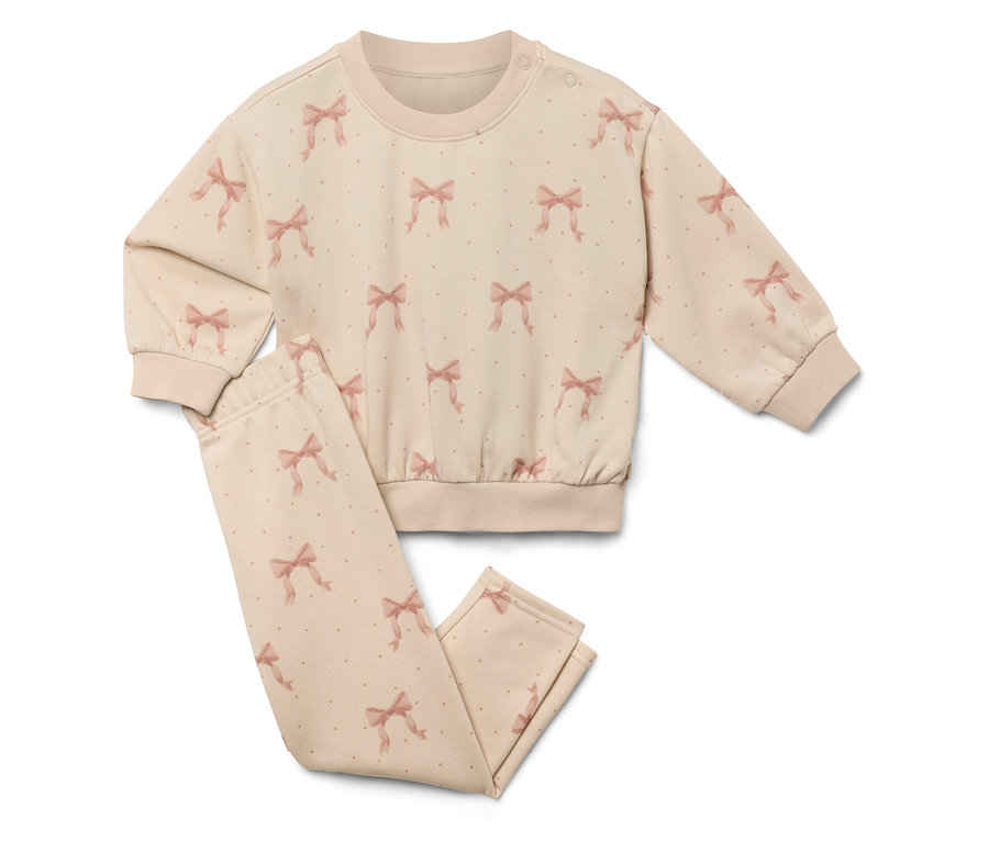 Béžová súprava s potlačou mašlí, pozostávajúca z mikiny a nohavíc.