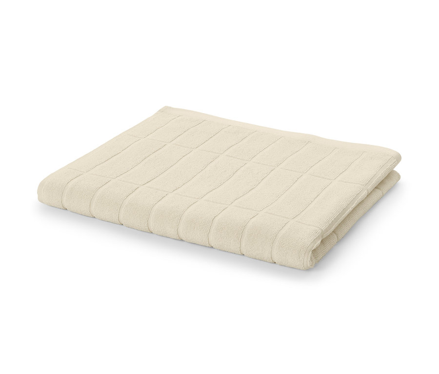 Krémovobiela osuška v prémiovej kvalite zložená na bielom pozadí.