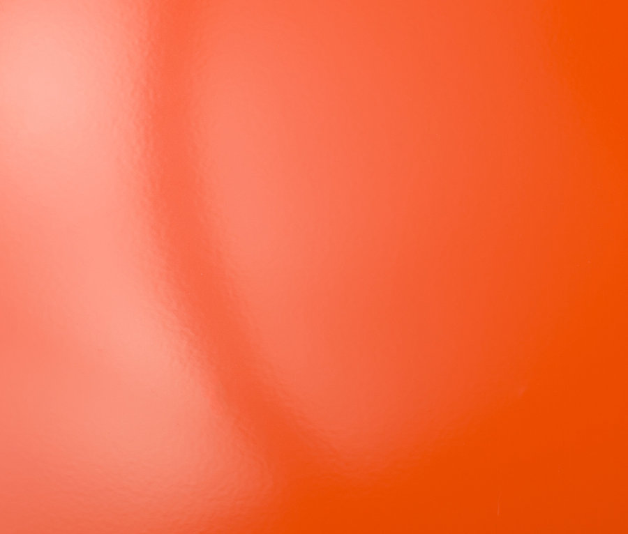 Oranžové pozadie s odleskami.