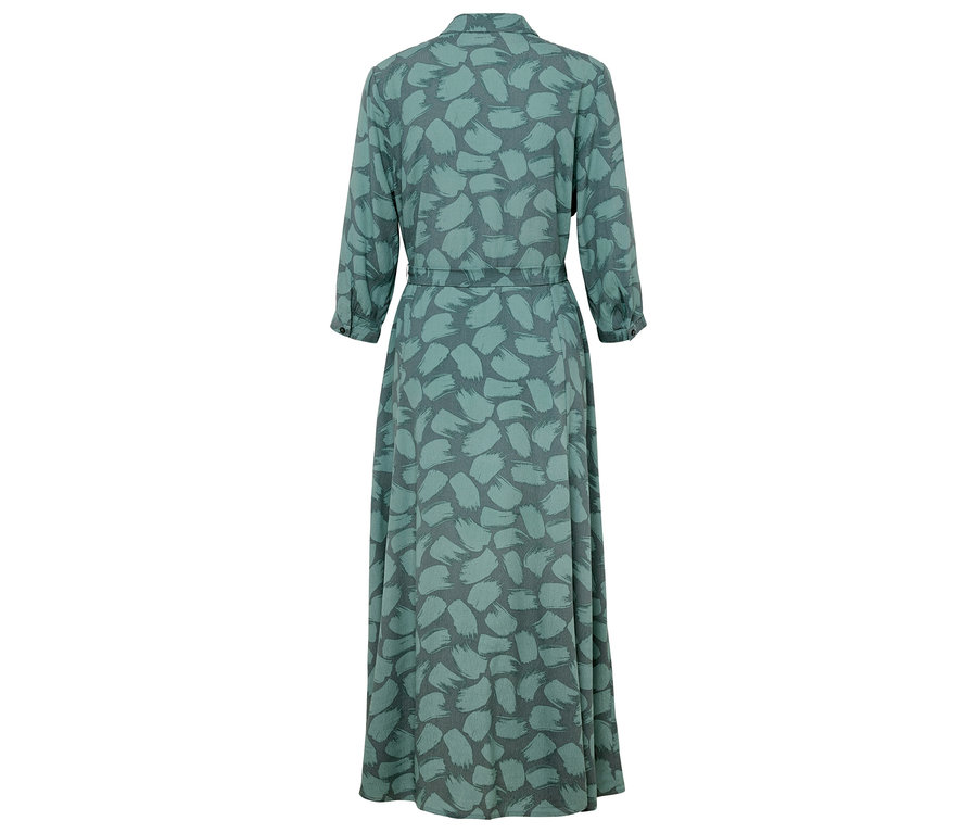 Pohľad zozadu na dlhé zelené šaty s potlačou.