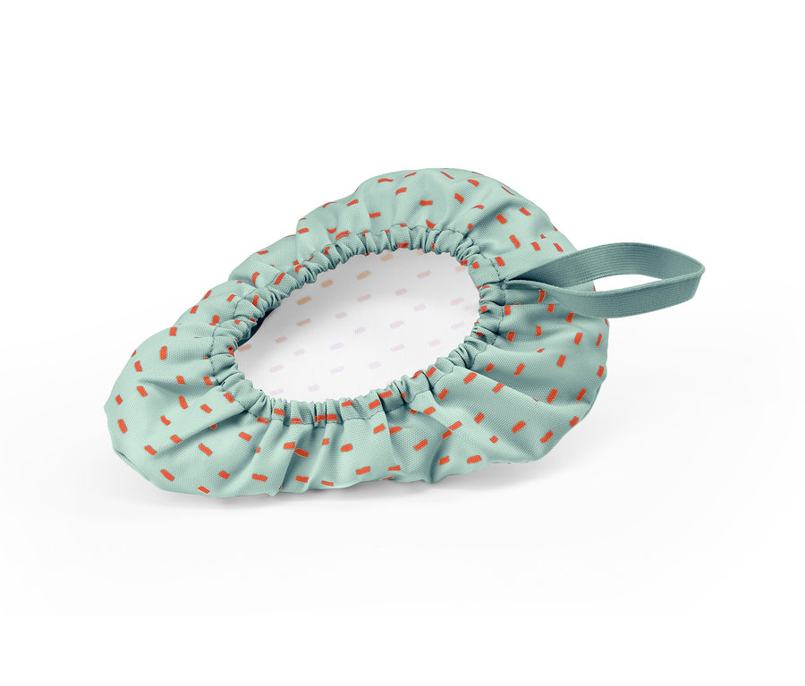 Detský poťah na sedadlo bicykla s oranžovými obdĺžnikmi na zelenom pozadí.