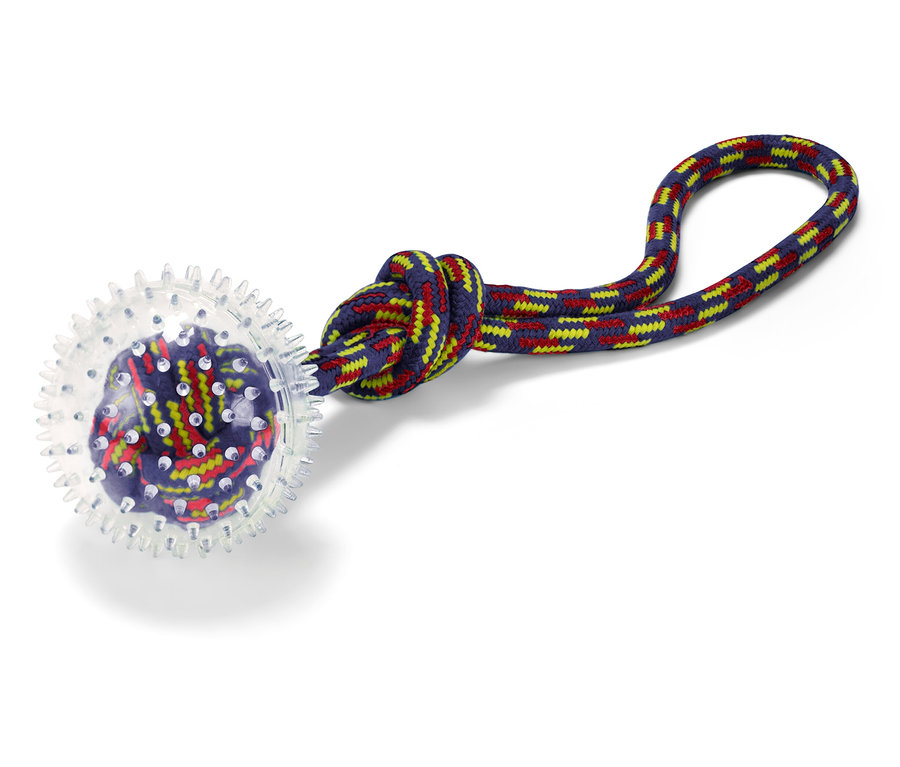 Hračka pre psov s priehľadnou guľou a farebným lanom.