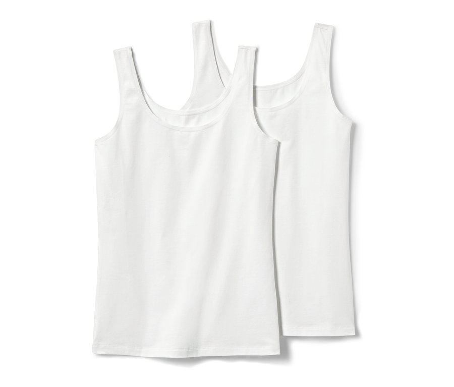 Dve biele tielka, 2 ks, ležia na sebe.