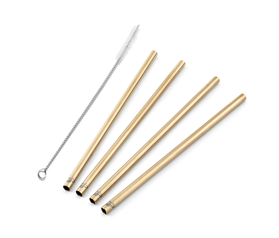 Štyri kovové slamky zlatej farby a čistiaca kefka.