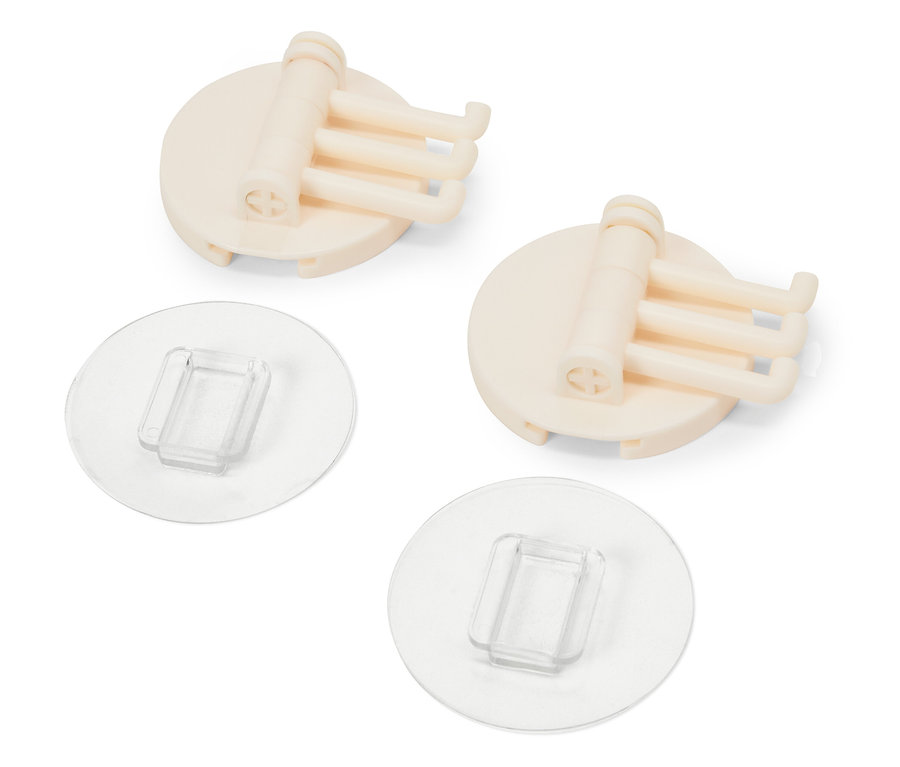 Dva béžové držiaky s tromi háčikmi a priehľadnými nalepovacími podložkami.