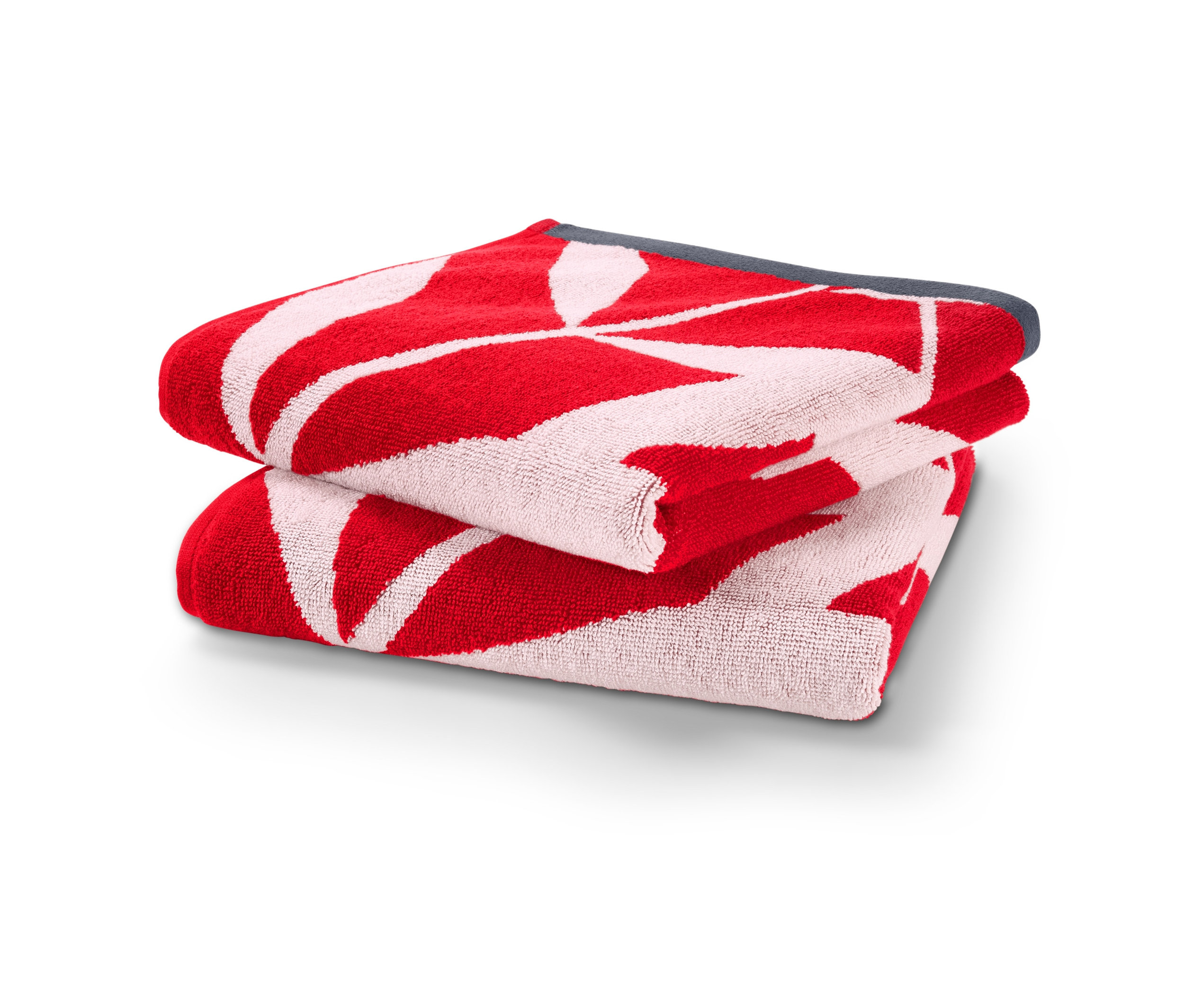 Dva žakárové uteráky malinovej farby zložené na sebe.