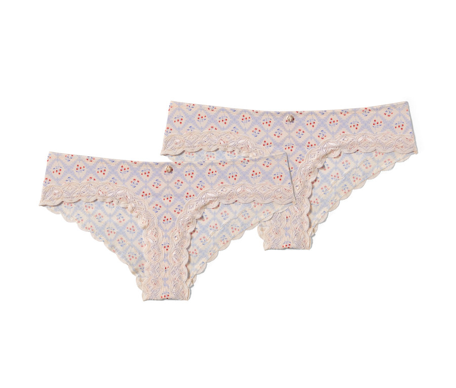 Dvoje krémové brazílske nohavičky s potlačou a čipkou.