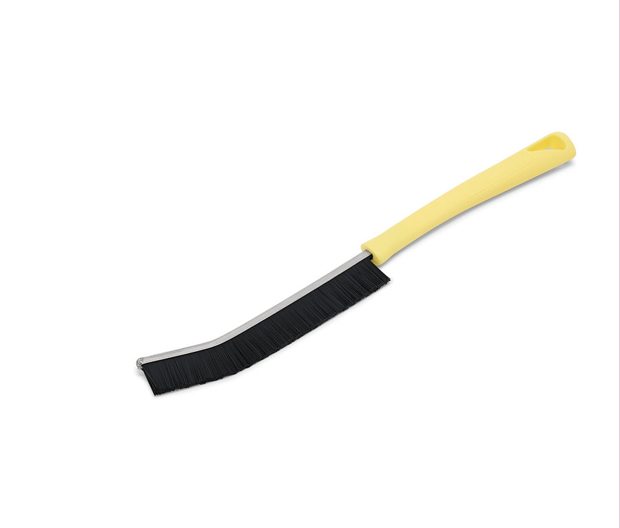 Žltá kefa s čiernymi štetinami na bielom pozadí.