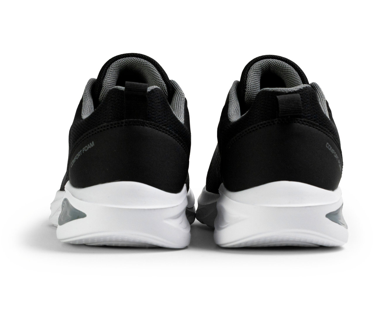 Dve čierne dámske športové topánky FILA Specctris s bielymi podrážkami, pohľad zozadu.