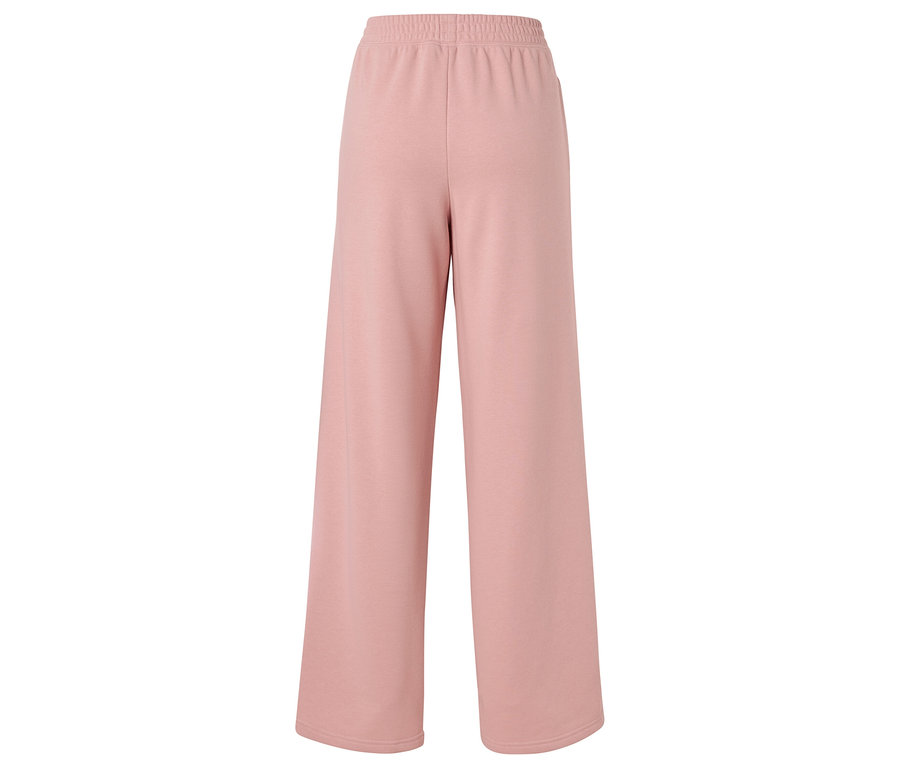 Ružové široké nohavice s elastickým pásom, izolované na bielom pozadí.