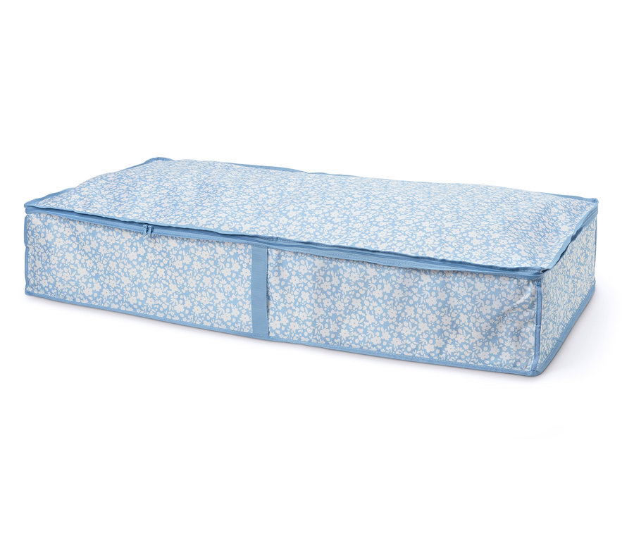 Komoda pod posteľ s modro-bielym kvetinovým vzorom a zipsom.