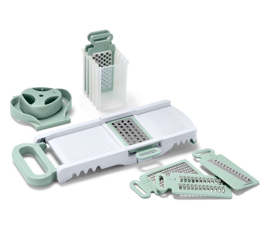 Sada kuchynských krájačov a strúhadiel s bielym telom a svetlozelenými detailmi.